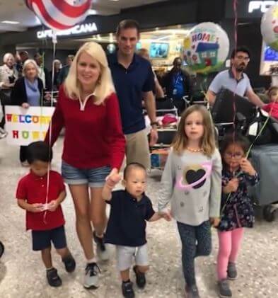 Chris Nagel with his wife and children